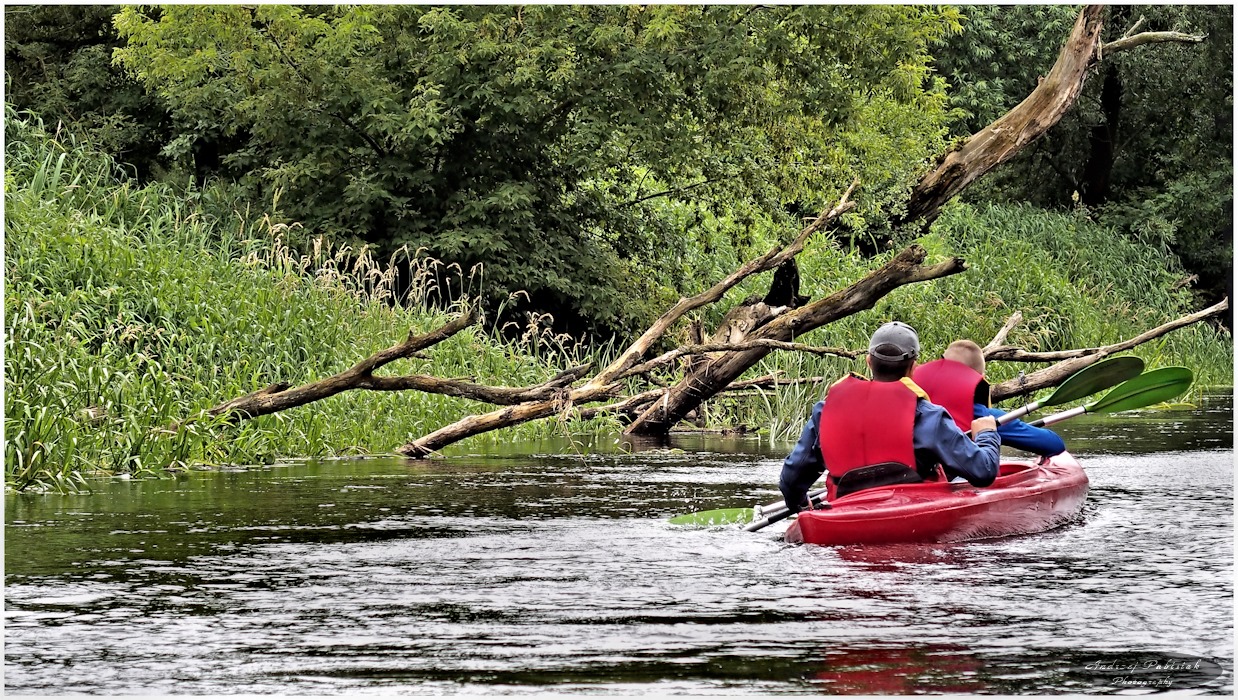 With the current of the river